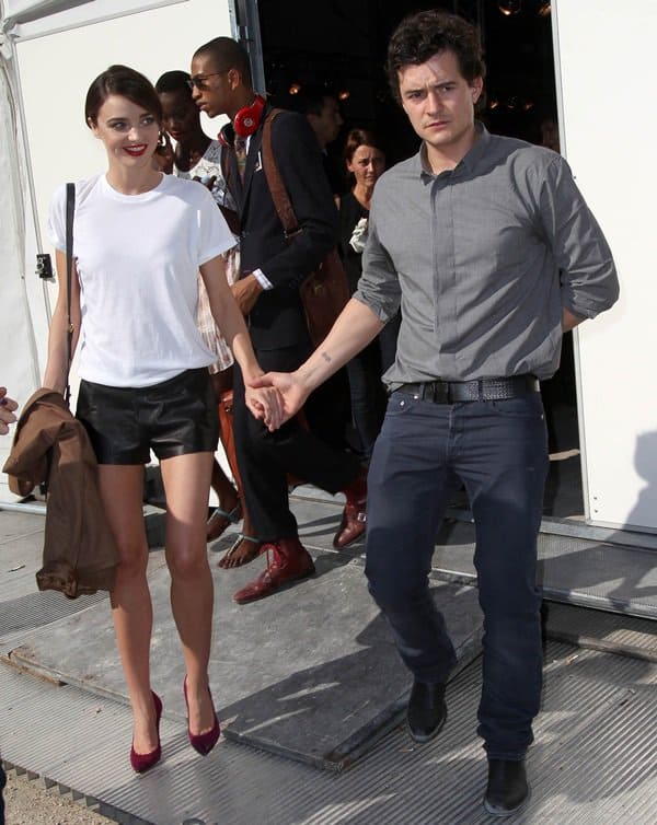 Miranda Kerr and Orlando Bloom attend the Christian Dior Ready to Wear Spring / Summer 2012 show