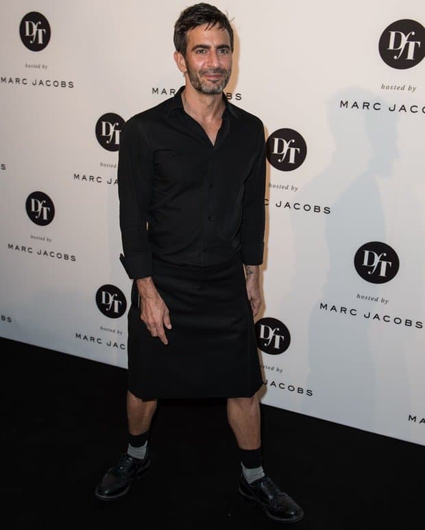 Marc Jacobs wears a black skirt with a matching shirt
