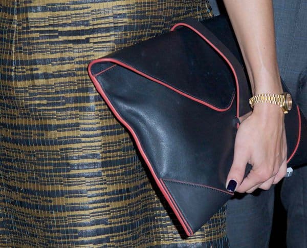 Olivia Palermo toting a red-trimmed leather envelope clutch from Reiss